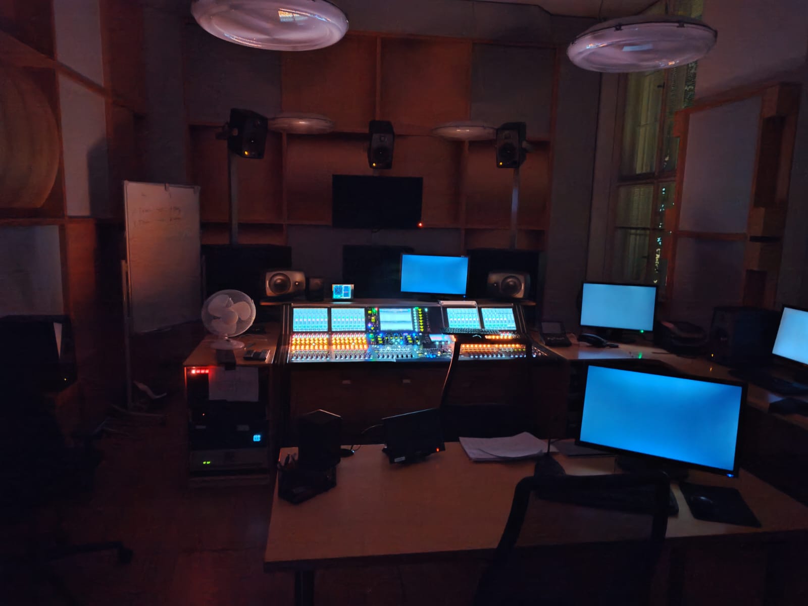 A university recording studio control room used by Thanos in 2023